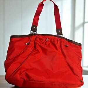 Baggallini Red/Orange Nylon Travel Tote Bag With Brown Accents & Multiple Compar